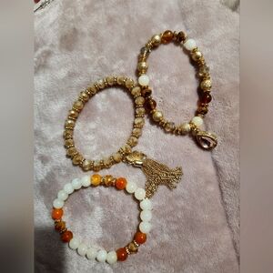 3 Gold orange brown and white beaded bracelets